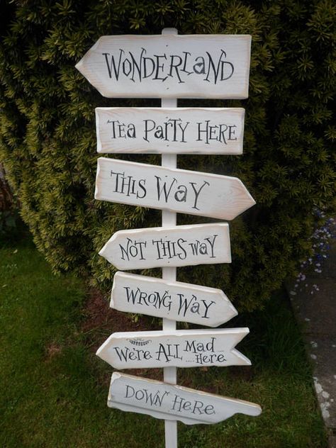 Fairy tale & Storybook signpost signs School reading corner  Wedding signpost Sign Alice in Wonderland, we're all mad here , this way.... that way signpost #ALICEINWONDERLANDFAIRYTALESIGNPOST Alice In Wonderland Garden, Deco Disney, Alice In Wonderland Decorations, Custom Wedding Decor, Alice In Wonderland Tea Party Birthday, Garden Party Theme, Alice In Wonderland Aesthetic, Alice In Wonderland Wedding, Mad Hatter Party