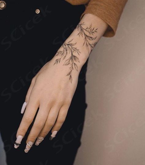 Vine Tattoo Wrist Wrap Around, Delicate Floral Hand Tattoo, Wrist And Finger Tattoos, Hand Cuff Tattoo, Simple Hand Tattoo, Wraparound Tattoo, Arms Tattoos, Back Of Hand Tattoos, Wrap Around Wrist Tattoos