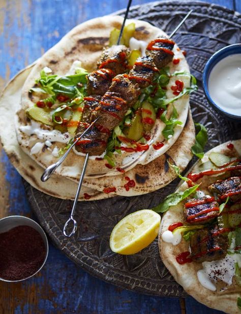 Lamb shawarma recipe | Sainsbury's Magazine Lamb Shawarma Recipe, Lamb Shawarma, Arabisk Mad, Garlic Yogurt, Lamb Kebabs, Cooking Pork Chops, Meat Skewers, Shawarma Recipe, Doner Kebab