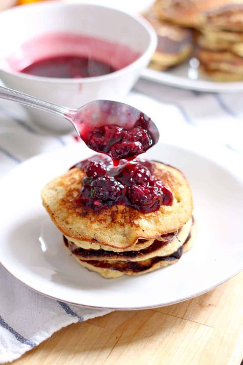 These honey cornmeal pancakes with blackberry maple syrup are 100% whole grain and refined sugar free! Crumbly and chewy like cornbread, slightly sweet and salty, and topped with a fresh blackberry sauce that can't be beat. Blueberry Syrup Recipe, Cornmeal Pancakes, Blackberry Sauce, Russian Dishes, Breakfast Photography, Blueberry Syrup, Pumpkin Pancakes, Syrup Recipe, Pancakes And Waffles