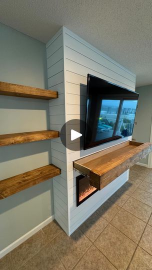 2.6K views · 835 reactions | 🚨Another Classic shiplap fireplace built out! 🚨

This shiplap themed fireplace built-in fits perfectly  inside this beautiful beach house! 🌊 🏖️ 

This also has a hidden secret! A very deep shelf inside of the mantle, the options are endless with these things!

Color - Pure White by @sherwinwilliams 
Fireplace - @touchstonehomeproducts 

#fashionista | #luxurylifestyle | #classy | #knesnikkreations | #style | #luxuryfashion | #designer | #trendy | #timelapse | #luxury | #fashionblogger | #instastyle | #accentwall |  #fashionstyle | #woodworker | #elegant | #luxurybrand | | #interiordesign | #stylish | #fashiondesigner | #fireplace | #beachhouse | #shiplap | #luxurystyle | #touchstone | #beach | #homedecor | #sherwinwilliams | #floatingshelves | #beachlife | Fireplace Stone Bottom Shiplap Top, Shiplap Fireplace Hidden Door, Diy Shiplap Fireplace With Hidden Door, Stone And Shiplap Fireplace, Vent Free Gas Fireplace Shiplap, Big Lots Shiplap Electric Fireplace, Living Room Entertainment Center, Shiplap Fireplace, Living Room Entertainment