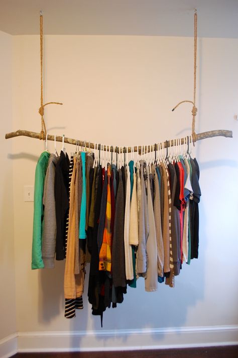 Clothing Rack Hanging From Ceiling, Diy Hanging Wardrobe Ideas, Clothes Hanging From Ceiling, Diy Wall Clothes Rack, Diy Wall Clothing Rack, Stick Clothing Rack, Hang Clothes On Wall Ideas, Exposed Clothes Rack, Clothing Rack From Ceiling