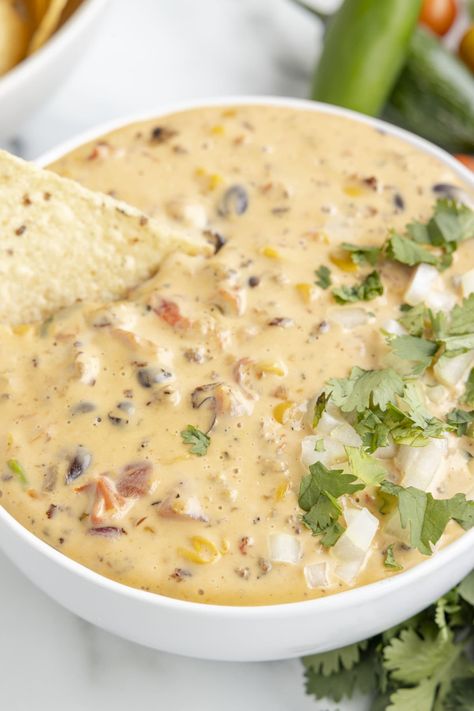 This recipe for Cowboy Queso is different from your average cheese dip. It has tasty mix-ins like sausage and beans. Make this creamy Velveeta queso for your next party, and it will surely please even the pickiest eaters! Best Queso Recipe, Cowboy Queso, Sausage Queso Dip, Sausage And Beans, Sausage Queso, Sausage Beans, Velveeta Queso, Cheese Spreads, Queso Dip Recipes