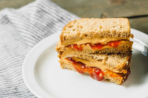 Classic Peanut Butter and Jelly Sandwich  Yields 1 sandwich  Ingredients:  2 tablespoons PB2  1 tablespoon low-sugar strawberry preserves  1 tablespoon water  2 slices whole grain bread, lightly toasted    Directions:    Mix the PB2, strawberry preserves and water together in a small bowl until well  combined; set aside.    Spread the PB2 mixture on both Peanut Butter Powder Recipes, Pb2 Recipes, Peanut Butter Jelly Sandwich, Peanut Butter And Jelly Sandwich, Jelly Sandwich, Peanut Butter Sandwich, Sandwich Ingredients, Clam Recipes, Healthy Sandwiches