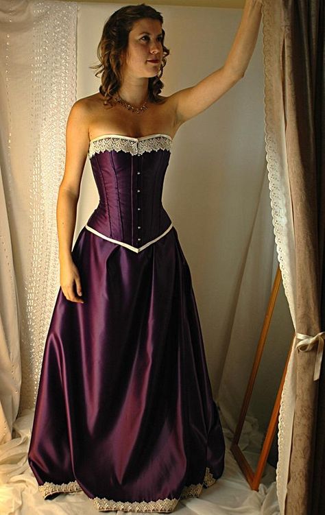 Available to see in our south coast boutique, all of our dresses are designed and made from scratch, in house in our UK studios. The Guinevere is a romantic corset gown fit for a queen, ready to take Arthurs hand. The deep and vibrant tones of the cadbury purple in a gorgeous, heavy duchess satin Tightlacing Corset, Ivory Bridal Gown, Purple Corset, Corset Gown, Black Halloween Dress, Lace Tights, Wedding Dresses Corset, Retro Mode, Halloween Dress