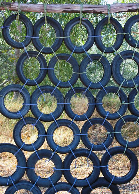 Climbing Wall Made Of Old Used Car Tires Stock Image - Image of made, park: 60238029 Tire Fence, Tyre Garden Ideas, Garden Ideas Kids, Tyre Garden, Tyre Ideas, Tire Playground, Diy Kids Playground, Tire Craft, Reuse Old Tires