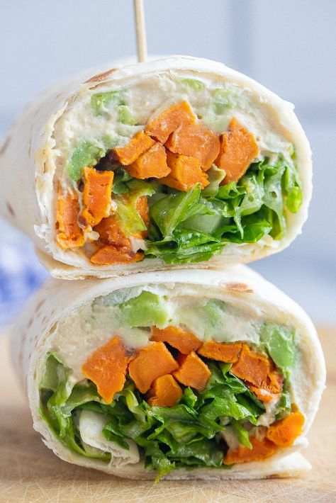 These Roasted Sweet Potato Wraps with Honey Mustard are easy to throw together and full of flavor! They're packed with hummus to add some protein and the sweet potato and honey mustard go together so well. The lettuce adds some crunch and keeps these vegan wraps nice and fresh. Make them for lunch and you'll be looking forward to them all morning! #wraprecipe #vegan #veggiewrap #hummuswrap #easylunch Potato Wrap, Hummus Wraps, Sweet Potato Wrap, Healthy Vegetarian Lunch, Potato Hummus, Vegetarian Wraps, Potato Sandwich, Sweet Potato Hummus, Work Recipes