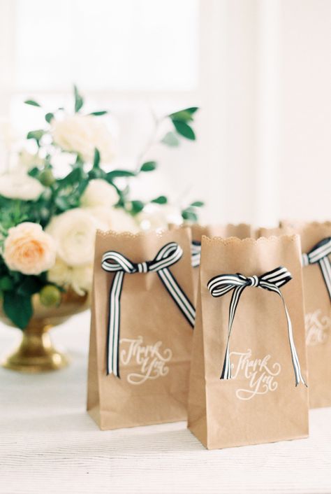 Bow wedding favors: http://www.stylemepretty.com/2015/09/23/darling-bow-wedding-details/ Photography: Ruth Eileen - http://rutheileenphotography.com/ Christmas Goodie Bags, Brown Paper Bags, Săpunuri Handmade, Paper Bag Crafts, Favors Diy, Brown Paper Bag, Wedding Favor Bags, Wedding Bows, Wedding Ribbon