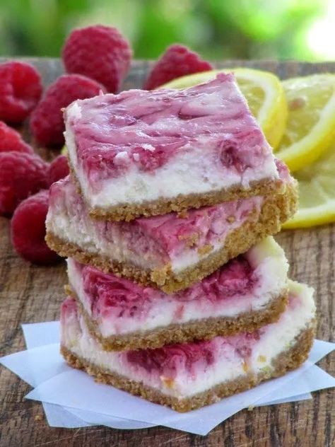 Lemon Raspberry Cheesecake Bars | Foodtalk Lemon Raspberry Cheesecake Bars, Swirled Cheesecake, Lemon Raspberry Cheesecake, Raspberry No Bake Cheesecake, Raspberry Cheesecake Bars, Raspberry Swirl Cheesecake, Blueberry Cheesecake Bars, Lemon Cheesecake Bars, Fig Cake