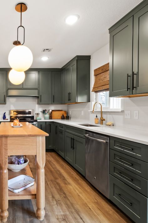 kitchen with bold green cabinets Green Kitchen Cabinets With Silver Appliances, Dark Green Cabinets Gold Hardware, Jade Kitchen Cabinets, Sage Green Lower Kitchen Cabinets, Antique Green Kitchen Cabinets, Green Lower Kitchen Cabinets, Dark Green Kitchen Cabinets, Cabinetry Kitchen, Black Stainless Steel Kitchen