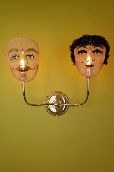 …nudge, nudge, wink, wink These handmade K’achampa masks are used to celebrate Corpus Christi and other rituals in Cusco. They are the perfect objet d’art for your sconce, chandelier, or lamp. We’ve fashioned them with clips for candelabra-sized bulbs. Pictured with the Vendome Sconce from Visual Comfort. 6.5"w x 8"h E Picture Frames Hung With Chains, Chic Holiday Decor, Things That Look Like Other Things, Artsy Lamp, Ceiling Art Ideas, Surrealist Decor, Weird House Decor, Circus Lamp, Vintage Eclectic Living Room