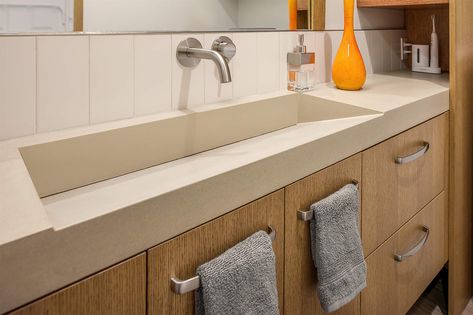 From hidden surprises behind cabinets to low-maintenance bathrooms and a kitchen design that encourages conversation, this home is a showcase of clever Custom Floating Shelves, Smart Bathroom, Trough Sink, Under Cabinet Lighting, Concrete Countertops, Guest Bathroom, Kitchen Projects, Custom Cabinets, Remodeling Projects