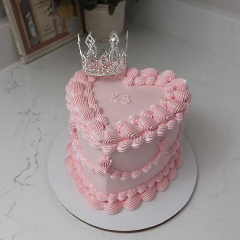 23 👑 - Cake Details - Size: Mini 6” (two layers) Add-ons: Silver crown (not edible) + glitter dust (edible) #emmacakes #seattle #emmacakesseattle #seattlecakes #customcakes #cakes #heartcake Crown On Cake, 23 Heart Cake, Baby Pink Heart Cake, Crown Cake Ideas, 15 Birthday Cake Ideas, Pink Crown Cake, 21 Birthday Cakes, Pink And Silver Cake, Pink Round Cake