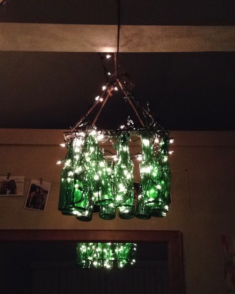 DIY Glass Bottle Chandelier Glass Bottle Chandelier Diy, Glass Bottle Chandelier, Bottle Chandelier, Glass Bottle Diy, Green Glass Bottles, Diy Chandelier, Bottle Lights, Project Inspiration, Frame Decor