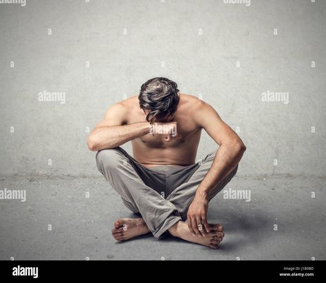 Download this stock image: Man crying and sitting on floor - J1B3BD from Alamy's library of millions of high resolution stock photos, illustrations and vectors. Sitting On Floor, Native Tattoos, Baby Krishna, Man Sitting, Image Processing, Anatomy Reference, Male Poses, On The Floor, The Floor