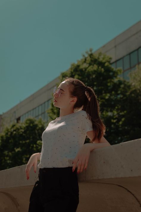 woman leaning on beige concrete rail while closing her eyes during daytime Woman Leaning On Railing, Leaning Against Railing Pose, Railing Poses, Leaning On Railing Pose, Leaning On Railing, Leaning Pose, Beige Concrete, Single Poses, Women Best