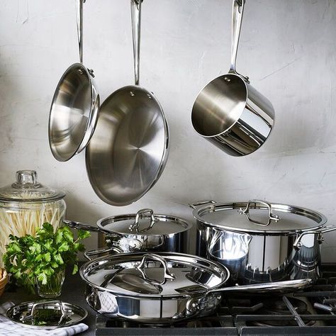 A useful assortment, the All-Clad Stainless 401488-R 10-piece cookware set includes 8 inch and 10 inch fry pans, a 3 quart covered Saute pan, 2 quart and 3 covered sauce pans, and an 8 quart covered stockpot. All-Clad’s Stainless 3-ply cookware features a thick-gauge aluminum core that attracts heat fast, while the addition of stainless steel ensures even heat distribution for consistent results across the entire cooking surface, all the way to the rim. Non Toxic Cookware, Best Cookware, Stainless Steel Pans, Cookware Set Stainless Steel, Copper Cookware, Stainless Steel Pot, Stainless Steel Cookware, Nonstick Cookware, Gourmet Kitchens