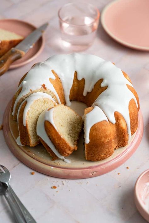 This vanilla bundt cake is so easy to make from scratch! The cake is super moist and fluffy and is topped with a simple sweet glaze. This bundt is the perfect entertaining cake and has a sweet vanilla taste everyone will love. It bakes up in less than an hour and is a real show stopper with minimal effort. Make this cake when you need something pretty but quick and easy! #vanillabundtcake #classicvanillacake #vanillabundt #vanillacake #bundt #bundtcakes #frostingandfettuccine White Bundt Cake Recipes, Moist Vanilla Bundt Cake, Vanilla Bundt Cake, White Brownies, Bourbon Caramels, Sweet Glaze, Make From Scratch, Pastry School, Bundt Cake Pan