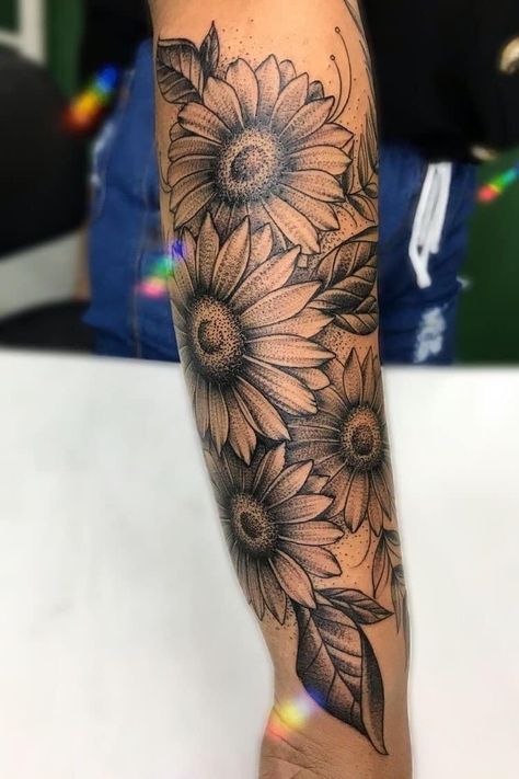 Daisy Flower Tattoos Sleeve, Clock Sunflower Tattoo, Black And White Sunflower Tattoo Sleeve, Sunflower Sleeve Tattoo Design, Feather Half Sleeve Tattoo For Women, Sunflower Field Tattoo Sleeve, Sunflower Arm Sleeve Tattoo, Arm Tattoos For Women Sunflower, Sunflower Tattoo Sleeve Shoulder