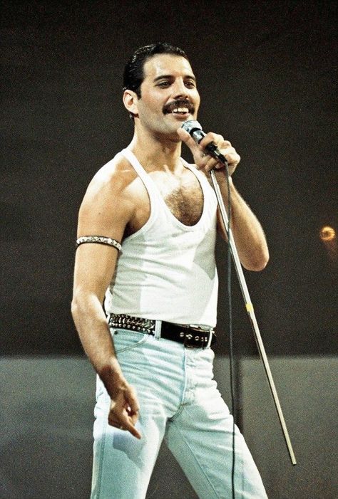 The Most Unforgettable, Iconic Looks From Freddie Mercury -- Pics! | Entertainment Tonight Freddie Mercury, On Stage, A Man, Singing, Queen, White