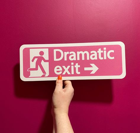 "In-house designed wooden sign. Printed directly on to 6mm MDF and CNC cut to shape. Measuring 35cm wide by 12cm high, this sign is just the perfect size to go above your door at home! This 'Dramatic Exit' sign is a humorous take on the regulatory UK fire exit sign. Featuring the same running silhouette person exiting a door and a similar font but the difference is the background is pink and instead of \"fire exit\" it reads \"dramatic exit\" which is a theatrical phrase for someone leaving a room or area in an over the top manor. Choose from a left pointing sign or a right pointing sign. A great present for a teenagers room, a drama queen or for all you humorous phrase loving maximalists out there! Attach to a wall using command strips, or if you want to suspend this sign from the ceiling Fire Exit Sign, Fire Exit, Running Silhouette, Deco Studio, Exit Sign, Cute Room Decor, Wooden Storage, Room Posters, Dream House Decor