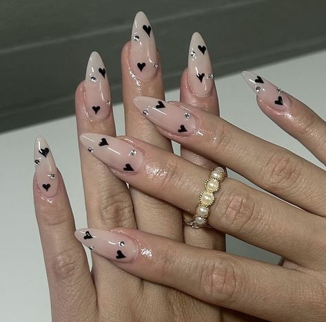 Feminine Valentines Day Nails, Valentine Nails With Hearts, Valentines Nails Black And Pink, Black Heart Nail Art, Nails Inspiration With Gems, Heart Acrylic Nail Designs, Black And White Heart Nails, Alternative Nail Ideas, White Almond Nail Designs