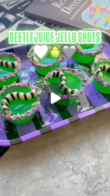 Johany Torres on Instagram: "🪲Beetlejuice Jello Shots🪲

I mean what’s a Halloween party without Jello shots right?  If you want this recipe type “Beetlejuice” 

🪲Worm mold & Green Apple @sonicdrivein gelatin from @walmart 
🪲Halloween Yum Crumbs from @michaelsstores @officialyumcrumbs 
🪲Beetlejuice drink tray @spirithalloween 

#spookycute #halloweenbaking #jelloshots #halloweenpartyideas #jelloshot #gelatina #halloweenfood #halloweenjelloshots #beetlejuice2 #beetlejuicebeetlejuicebeetlejuice #beetlejuicebeetlejuice" Shrek Jello Shots, Beetle Juice Jello Shots, Beetlejuice Jello Shots, Beetlejuice Birthday Party Food, Beetlejuice Drink Recipe, Jello Brain Mold Recipe, Beetlejuice Food Ideas, Beetlejuice Snacks, Beetlejuice Party Food