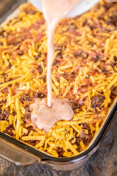 Deep Dish Taco Pie - the ultimate Mexican casserole! Taco meat, rice, corn, cheese, salsa, and eggs baked in pie crust. I mean, what's not to like?!? This makes a ton. It is perfect for a crowd. Can make the casserole in advance and refrigerate or freeze for later. We sometimes divide the recipe between two pans - bake one and freeze one for later. Top the casserole with your favorite taco toppings. Taco night never tasted so good! #taco #casserole #rice #Mexican #freezermeal Taco Pie, Corn Cheese, Mexican Casserole, Plain Chicken, Taco Casserole, Hamburger Recipes, Taco Meat, Beef Recipes Easy, Beef Dishes