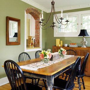 Dinning room with green walls and country furniture. Dining Room Paint Colors, Green Dining Room, Black Chairs, Dining Room Paint, Room Brown, Sage Green Walls, Iron Chandelier, Dining Room Colors, Brown Walls