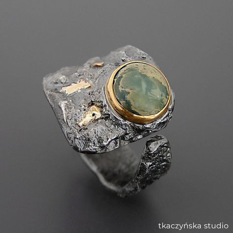 "Ocean Treasure Jasper Ring, Unique Statement Gold and Silver Ring, Big Edgy Organic Style Ring, Sea Floor Inspired Ring, Contemporary Ring Big statement raw ring with a gorgeous pastel Ocean Jasper.  Blue-green and yellow stone is set in 22 k gold bezel. Rough ring band with fused 14 k gold is black patinated and brushed. Statement organic design. Materials:  jasper, 925 silver, 22 k gold, 14 k gold Dimensions of the stone:  diameter 9 mm (23⁄64 in) Dimensions of the ring: the width 19 - 5 mm (3⁄4 - 13⁄64 in) Weight: 16,67 g (0,59 oz) The ring is size: Europe 22,  Great Britain T,  USA 9 3/4, France 62, Germany 19 1/2, Japan 19 Ring is adjustable, its size can be changed. Other sizes are available to order (the ring can be made with a similar Ocean Jasper). To determine the correct size, Ancient Treasure, Raw Ring, Wide Wedding Rings, Avant Garde Jewelry, Sea Floor, Mixed Metal Rings, Metal Jewellery, Ocean Treasures, Jasper Ring