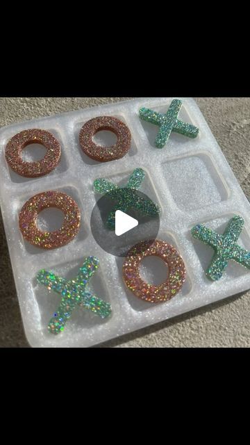 The Resin Rainbow on Instagram: "Continuing the games theme from the dominoes, say hello to this little noughts and crosses (or tic-tac-toe) set!! Made with Apex High Gloss for a bubble free and shiny finish @just4youonlineuk The board is 'Shimmer White' pigment paste also from @just4youonlineuk and the counters are made with 'Tranquil' and 'Courage' glitters from @createandbloomcrafts ✨ For 15% off at @just4youonlineuk you can use my code RAINBOW15 - no minimum spend #resin #resincrafts #resincrafter #resingame #resingameboard #resintictactoe #tictactoe #noughtsandcrosses #resinnoughtsandcrosses #resintravelgame #travelgame #glittery #sparkles #holographic #shimmer #resinpour #resindemould #glitterinthesun #handmade #handmadeuk #handmadewales #welshresincrafter #welshresinsrtist" Resin Tic Tac Toe, Resin Rainbow, Noughts And Crosses, Circle Game, Resin Pour, Game Themes, Tic Tac Toe, Tic Tac, The Games