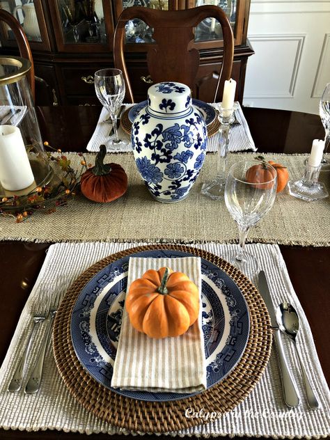 Blue and Orange fall place setting for fall or Thanksgiving.  #falltable #blueandwhite #placesettings #tablesettings #tablesettingideas #thanksgiving #thanksgivingtable Navy Blue Dining Room Walls, Blue And Orange Fall Decor, Navy Blue Dining Room, Blue Thanksgiving Table, Blue Dining Room Walls, Orange Fall Decor, Blue Thanksgiving, Tablescapes Autumn, Blue Dining Room