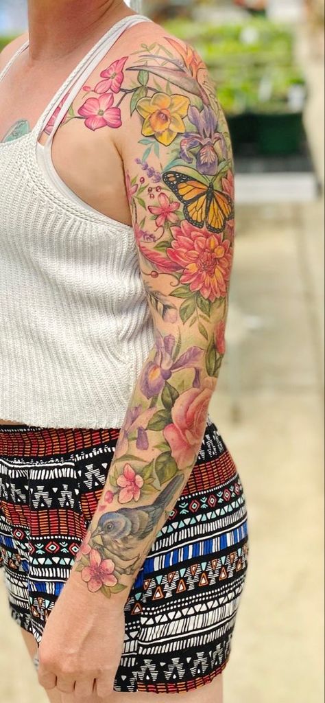 22 Colorful Tattoo Ideas for Women: Unleash Your Vibrant Side Colorful Tattoo Ideas, Half Sleeve Flower Tattoo, Half Sleeve Tattoos Color, Tattoo Bein Frau, Arm Tattoos Color, Colorful Sleeve Tattoos, Floral Arm Tattoo, Colorful Flower Tattoo, Realistic Flower Tattoo