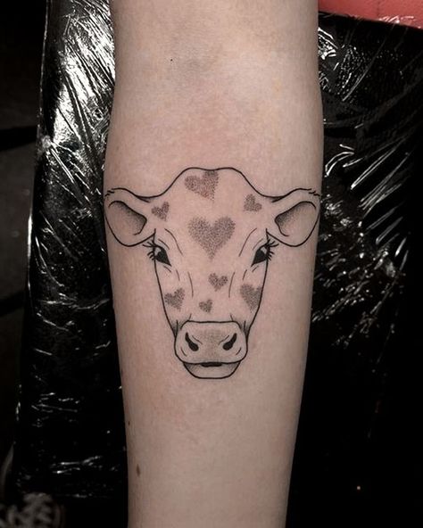 Step into the farmyard of fashion with cow tattoo designs! We've rounded up over 70 cow tattoo ideas that are just udderly irresistible. Small Animal Tattoo Ideas, Small Animal Tattoo, Cow Tattoo Ideas, Highland Cow Tattoo, Small Tattoo Ideas For Men, Flesh Tattoo, Cow Tattoo, Astronaut Tattoo, Sweet Cow