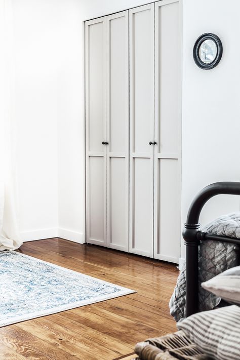 Low-Key, We Can't Get Enough of These 7 Gorg Closet Door Ideas for Bedrooms | Hunker Bifold Door Makeover, Gray Closet, Bifold Doors Makeover, Wood Closet Doors, Folding Closet Doors, Laundry Doors, Closet Door Makeover, Bifold Door, Bifold Closet Doors