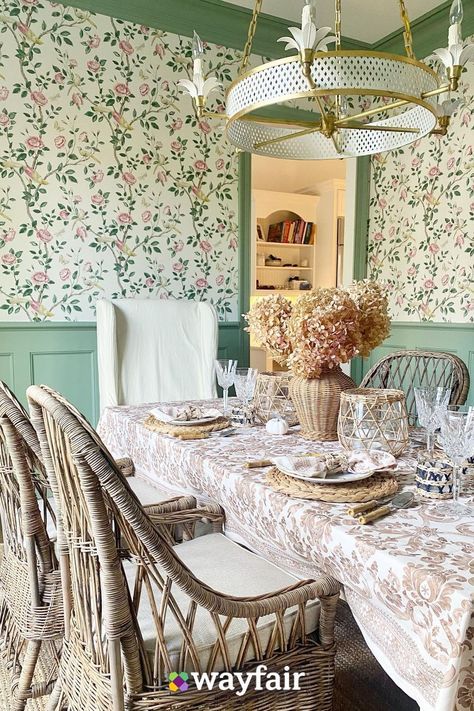 Give your dining room a boho makeover with new rattan chairs, floral wallpaper, and gold-detailed chandelier. Proof that small updates can make a big difference. Dining Buffet Decor, Floral Dining Room, Cozy Cottage Interiors, Cottage Core Home, Wallpaper Paint, Earthy Home Decor, Earthy Home, Dining Room Wallpaper, Cottage Style Decor