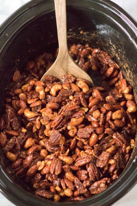 The best crockpot candied nuts recipe! An easy recipe and tips on how to make them in the slow cooker! The perfect holiday gift or addition to a salad! Candied Walnuts Easy Crockpot, Crockpot Candied Nuts Recipe, Candied Mixed Nuts Recipe, Candied Mixed Nuts Easy Recipes, Candied Nuts Recipe, Slow Cooker Candy, Sugar And Spice Candied Nuts Smitten Kitchen, Best Crockpot, Crockpot Candy