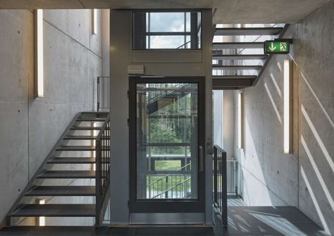 Metal staircase wrapped around a central glass lift shaft, in the Sport Hotel, Klingenthal, Germany Residential Staircase, Staircase Design Ideas, Stair Elevator, Terminal Bus, Home Design Store, House Lift, Elevator Interior, Contemporary Staircase, Stair Lift