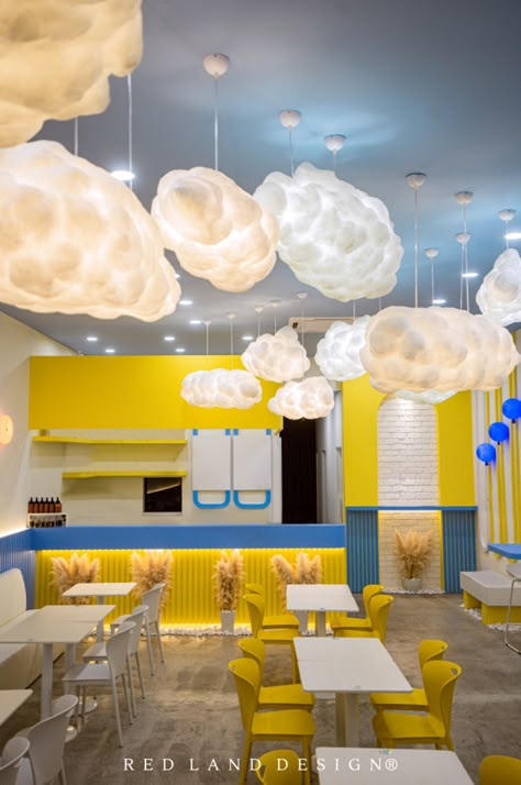 The playful combo of yellow 🟡, skye blue, and white turns this limited space into a vibrant teenage zone. Yellow Coffee Shop, Yellow Restaurant, Colorful Cafe, Tea Branding, Land Design, Blue Cafe, White Restaurant, Play Cafe, Selfie Wall