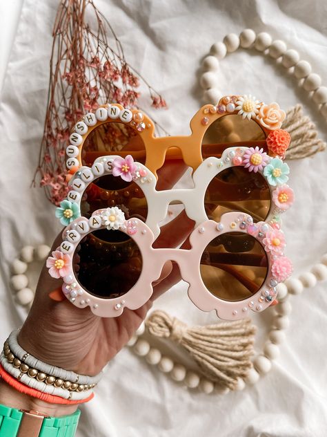 These Sunnies are what boho dreams are made of... dainty florals and extra sparkle and shine make these sunglasses truly one of a kind. You choose the color and the name/saying and I do the rest! You can also specify main colors you want or don't want in the design. Beaded Sunglasses Diy, Personalised Sunglasses, Cozy Hobbies, Flower Girl Toddler, Hippie Birthday Party, Diy Sunglasses, 11 Birthday, Navy Birthday, Scout Swaps