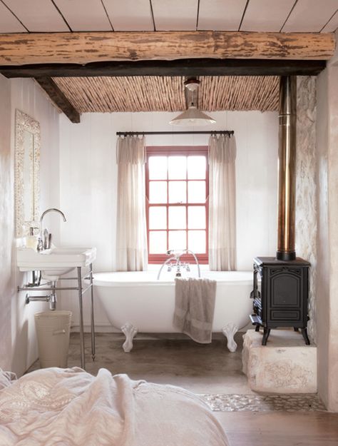 A wood burning stove by the bathtub?!  Oh yes!  All it's missing now is a flatscreen on the wall!  I'd never leave the tub! Cottage Bathroom, Wood Burner, In Bathroom, Farmhouse Bathroom, Beach Cottage, Wood Burning Stove, Beautiful Bathrooms, Wood Stove, Bathroom Inspiration