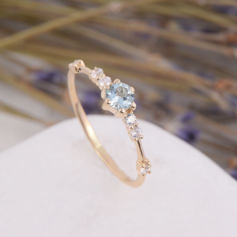 Tiny womens sky blue topaz engagement ring, Dainty & simple 14k yellow gold blue topaz promise ring for her,Gift for her, Anniversary gift WE OFFER UNLIMITED PERIOD INSTALLMENTS PLAN This is a beautiful, stunning, feminine ring that works well for all occasions, styles, and ages. You will love it! Ring information: Main stone: Sky blue topaz Approximate size: 4.0mm Accent stones: Cubic zirconia Approximate size: 1.75mm (6 stones) Approximate weight of stones: 0.376ct ( in total) Approximate Senior Ring, Sky Blue Topaz Engagement Ring, Blue Topaz Promise Ring, Blue Sapphire Promise Ring, Cute Promise Rings, Promise Rings Simple, Engagement Ring Dainty, Silver Promise Rings, Blue Topaz Engagement Ring