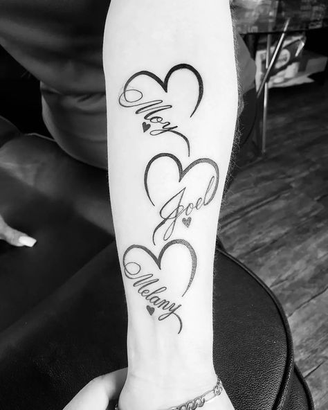 Open Heart Tattoo With Names, Heart Tattoo Memorial, Tattoo Ideas With Daughters Name, Moms Tattoo Ideas For Kids, Hearts With Birthday Tattoo, Names With Hearts Tattoos, Love Heart Tattoo With Name, Feminine Heart Tattoos, Heart With Name Tattoo Ideas