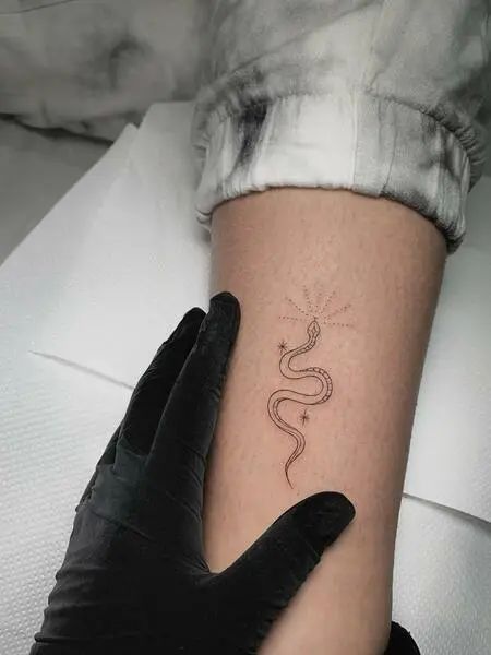 Minimalist Snake Tattoos Small Snake Wrap Around Tattoo, Classy Snake Tattoo, Single Needle Snake Tattoo, Micro Snake Tattoo, Delicate Snake Tattoos For Women, Snake Rib Tattoos For Women, Minimalist Tattoo Snake, Taylor Swift Snake Tattoo, Snake Tattoo Wrist