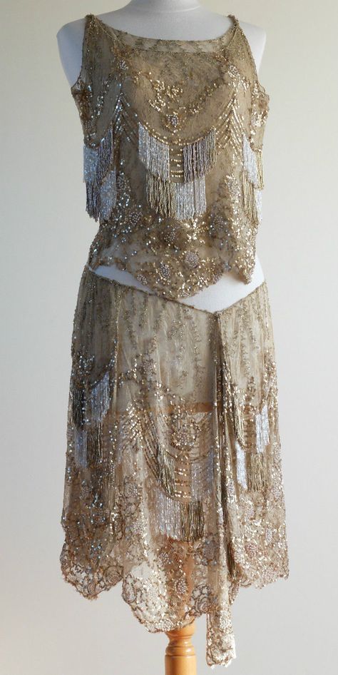 1920s Gold Art Deco Flapper Dress Dance Costume Showgirl Burlesque. It is made from a silk lace, covered in the most delicate beadwork and given movement by the panels of beaded fringe in gold, clear and white glass. The fabric is a soft gold embellished with tiny gold sequins, pearls and tiny glass tubular beads. There are also panels of beaded fringe which really animate the outfit. The final flourish is given by repeated motifs created with tiny pearl beads. Front Art Deco Clothing, 1920 Dress, 1920 Fashion, 20s Fashion, Skirt And Top, Flapper Style, 1920s Dress, Dance Skirt, Gold Art Deco