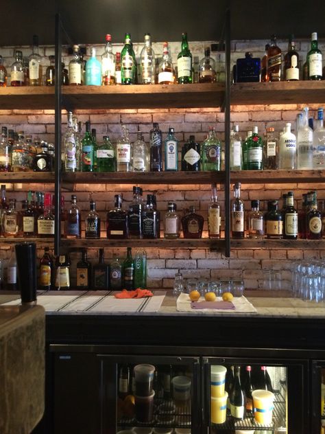 Ghibelline bar, 14th St Corridor. Love these rustic-looking wood shelves. Industrial Bar Shelving, Rustic Bar Shelves, Rustic Sports Bar, Behind Bar Ideas, Rustic Bar Ideas, Back Bar Shelving, Bar Backs, Back Bar Design, Sport Bar Design