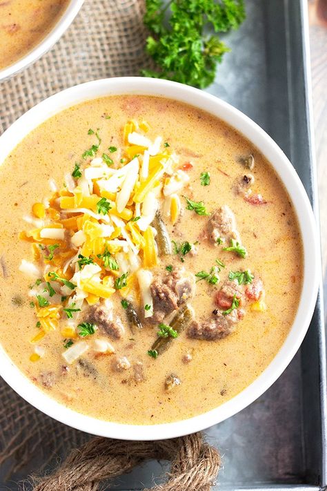 This Slow Cooker Cheeseburger Soup is comforting, warming, and tastes like a cheeseburger in creamy soup form! With lean ground beef, delicious veggies, and a cheesy broth, this soup is as hearty and flavorful as they come. Slow Cooker Cheeseburger Soup, Hamburger Rice, Cheese Burger Soup Recipes, Recipes Slow Cooker, Low Carb Soup Recipes, Cheeseburger Soup, Cheese Burger, Low Carb Soup, Soup Recipes Slow Cooker