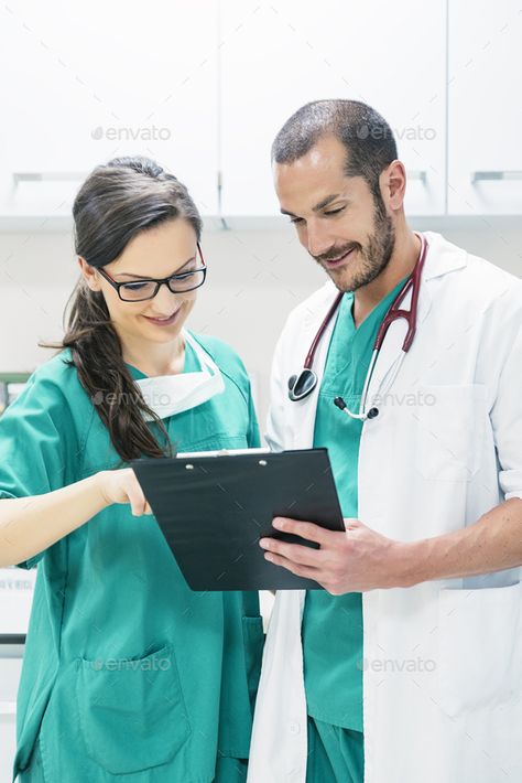 Doctor and nurse examining report of patient by nunezimage. Doctor and nurse examining report of patient. Medical Concept #AD #examining, #report, #Doctor, #nurse Health Photos, Doctor And Nurse, Medical Photos, Hospital Photos, Nurse Doctor, In Hospital, Fashion Website, Clipboard, Medical Professionals