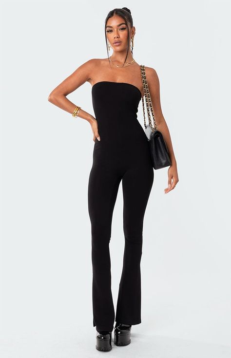 Online Only! This strapless jumpsuit features a flared leg with side slits, adding a little something extra to your outfit. The versatile design makes it perfect for any season, with the option to layer with jackets or sweaters in cooler weather or accessorize with sandals in warmer months.   	Jumpsuit 	Strapless neckline 	Flared leg 	Side Slits 	Polyester, Spandex 	Model wears size S 	Model height is 5'7 	Item care: Wash with similar color Flare Jumpsuit Outfit, Womens Jumpsuits Formal, Strapless Jumpsuit Outfit, Flared Jumpsuit, Black Strapless Jumpsuit, Visionary Fashion, Pants Jumpsuit, Solid Color Jumpsuits, Flare Jumpsuit