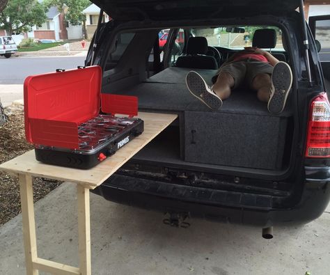 I helped my little brother build a camper conversion for his 4Runner this weekend. It is a three part assembly with a cabinet door, slide out table, under storage and a sleeping area. The middle seat section also comes out and slides over the back section so you can still fold up and use the back seats. Materials1 1/2 sheets plywoodcouple 2x4scouple 2x2shingescarpetgluescrews/nailshandlesGate latch Suv Slide Out Storage, 4runner Camper, Suv Life, 4runner Camping, Van Volkswagen, Door Slide, Vw T3 Syncro, Kangoo Camper, T3 Vw